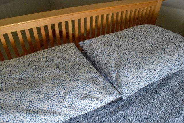 Natural & Organic Bedding Guide - Coyuchi organic cotton sheets and duvet on bed