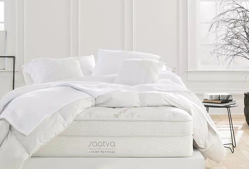 white Saatva mattress and bedding