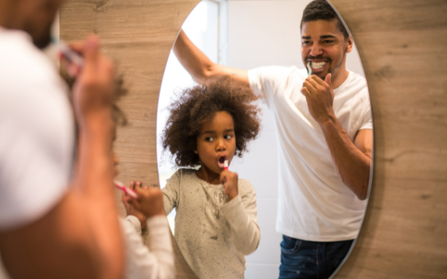 family brushing teeth